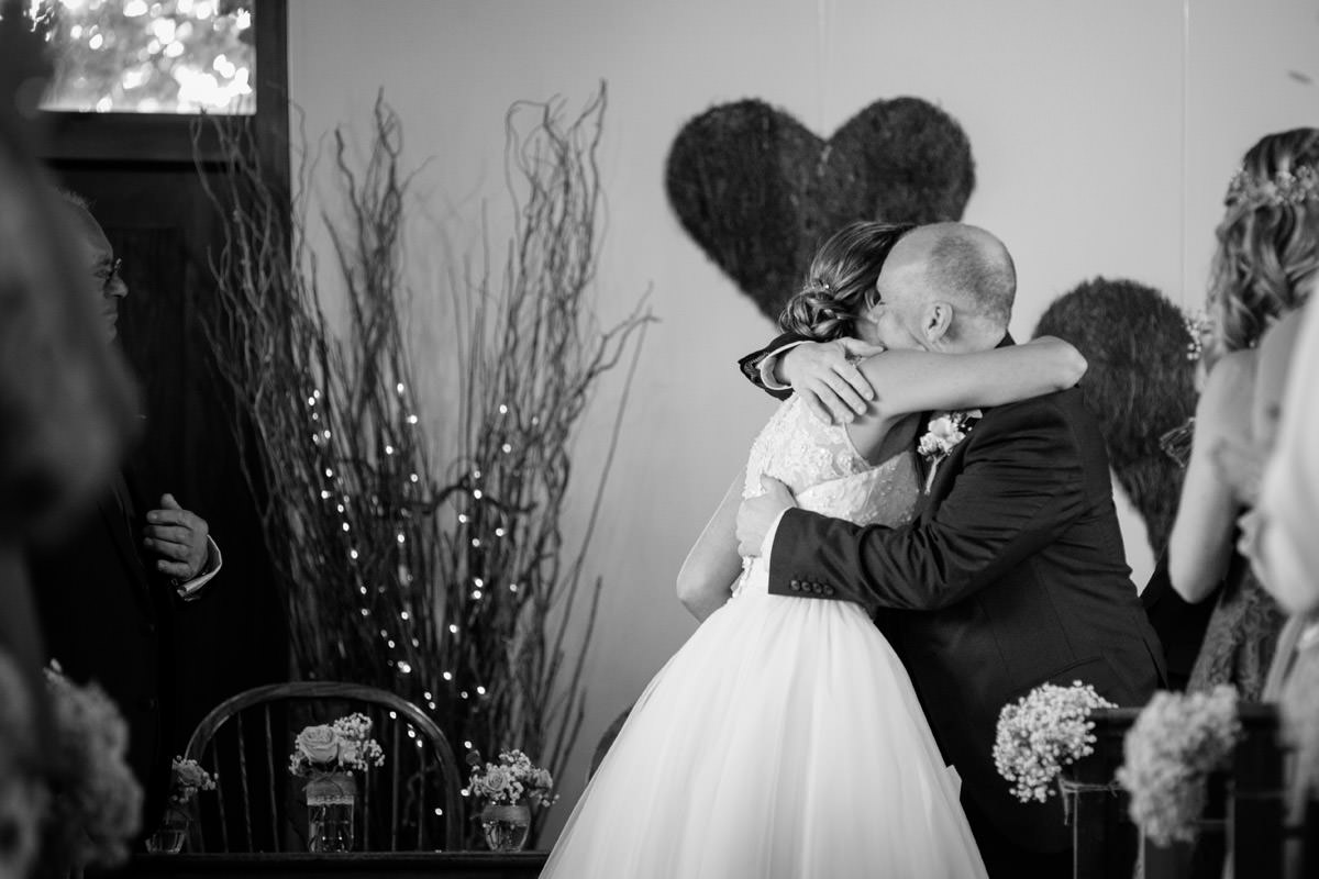 Bride & best Man hugging after the ceremony at Dodmoor House