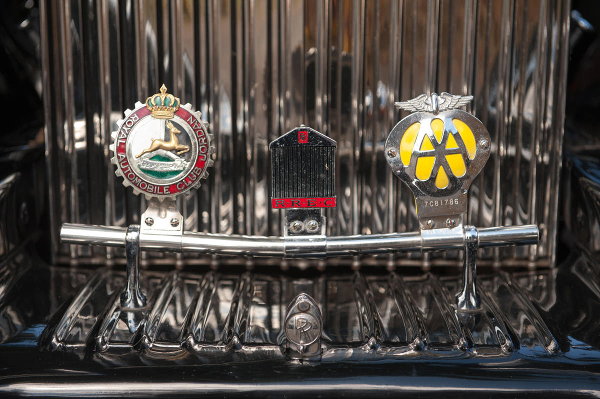 Badges on a vintage car grill