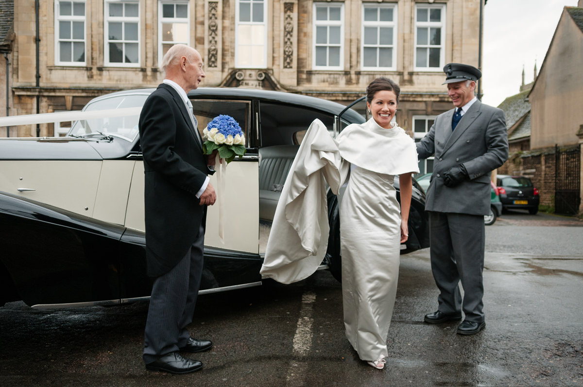 A bride getting out of the wedding car