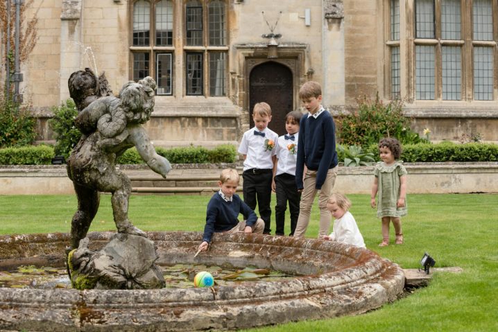 Children playing in the courtyard at Rushton Hall during the drinks reception