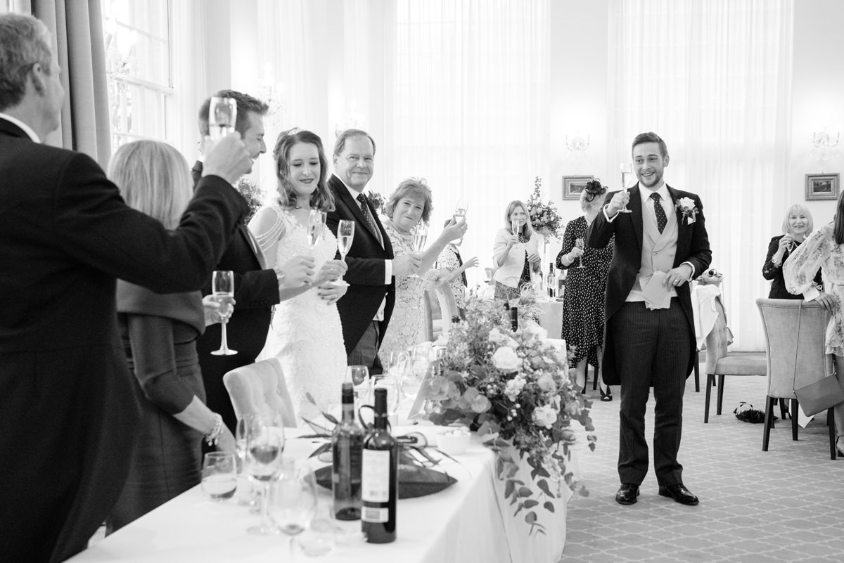 Best man making toast during speeches at Rushton Hall in Kettering