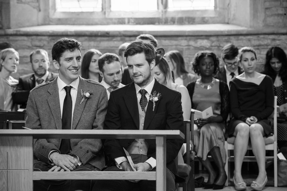 Ushers waiting for the bride to arrive at St Mary's church in Geddington, Northants