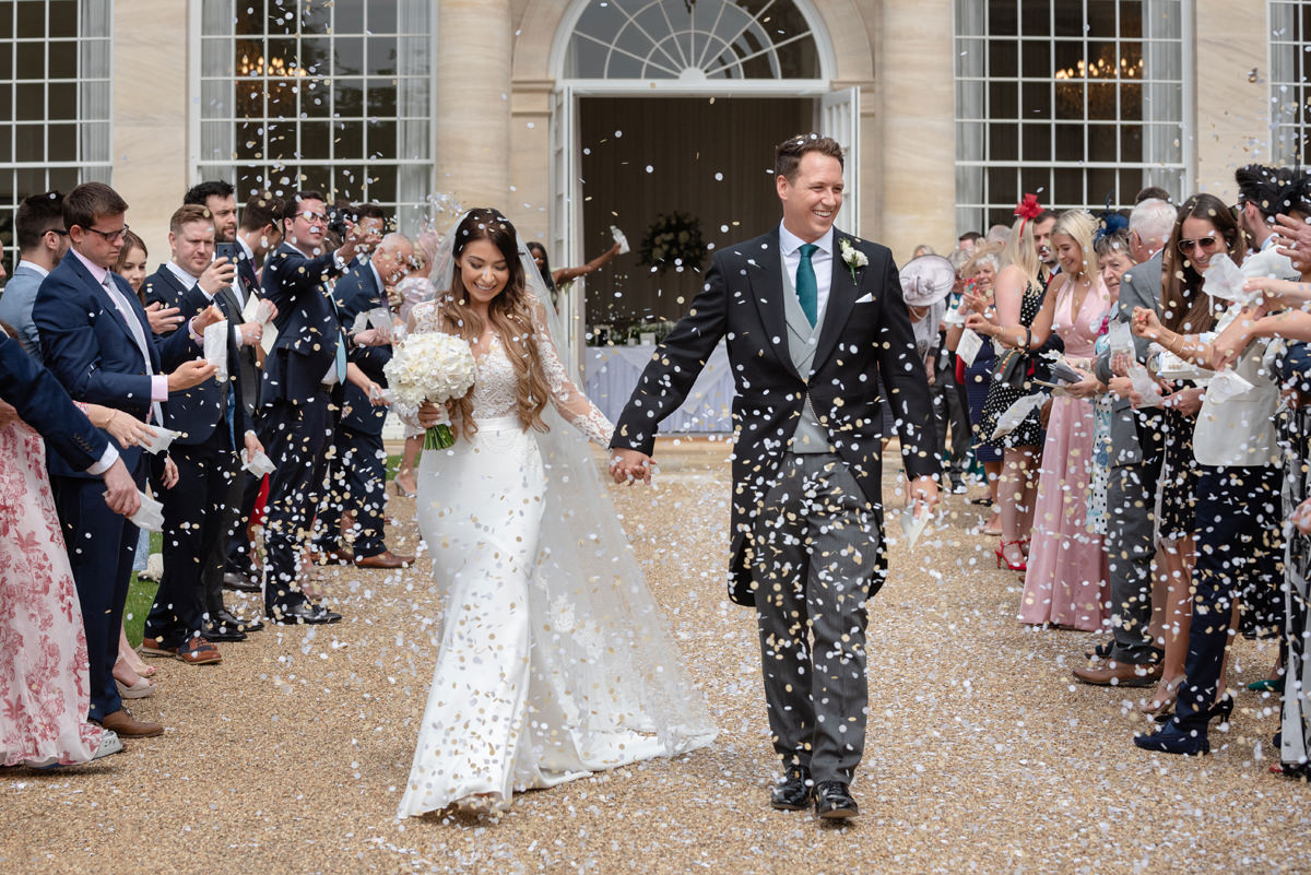 Confetti in front of the orangery at Rushton Hall
