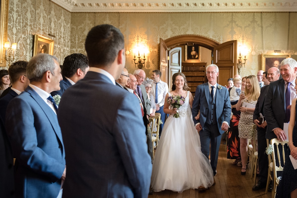 Bride walking down the aisle at Holdenby House