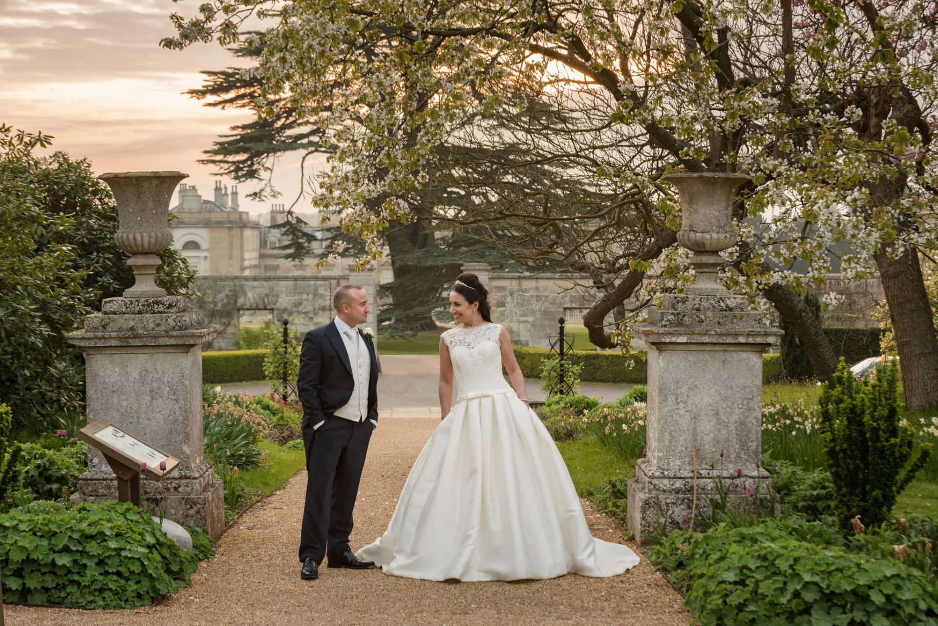 Bride and groom in gardens at Woburn Abbey
