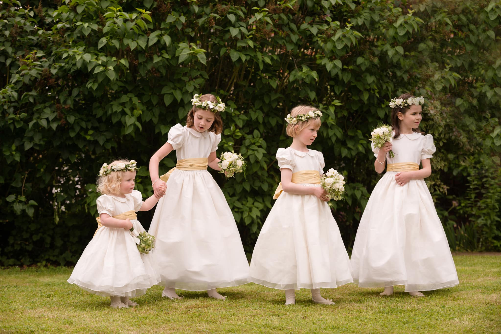 Four flower girls waiting their turn for a group photo