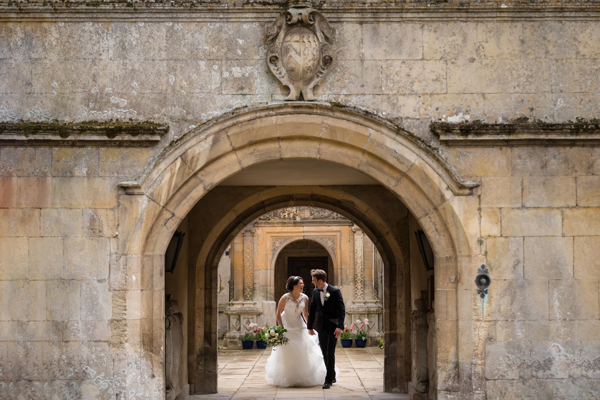 Bride and groom in the courtyard at Deene Park