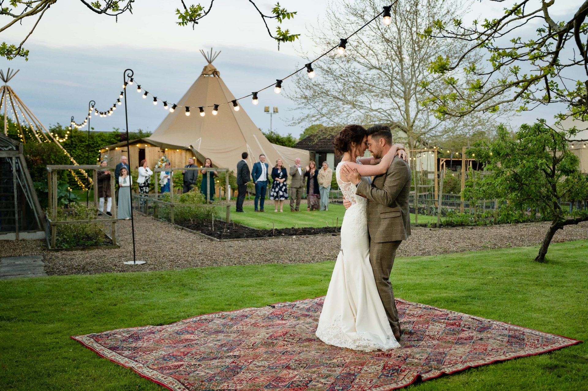 Outdoor first dance on a persian rug at Hill Farm House in Brigstock