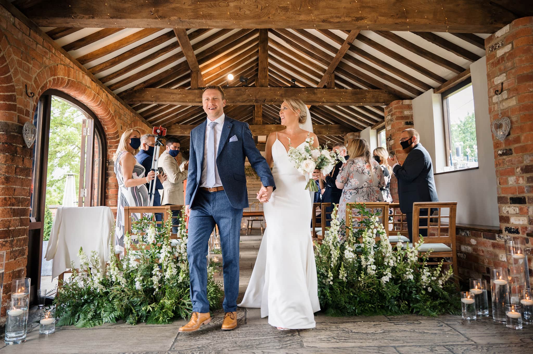 Bride & groom walking down aisle at Dodmoor House