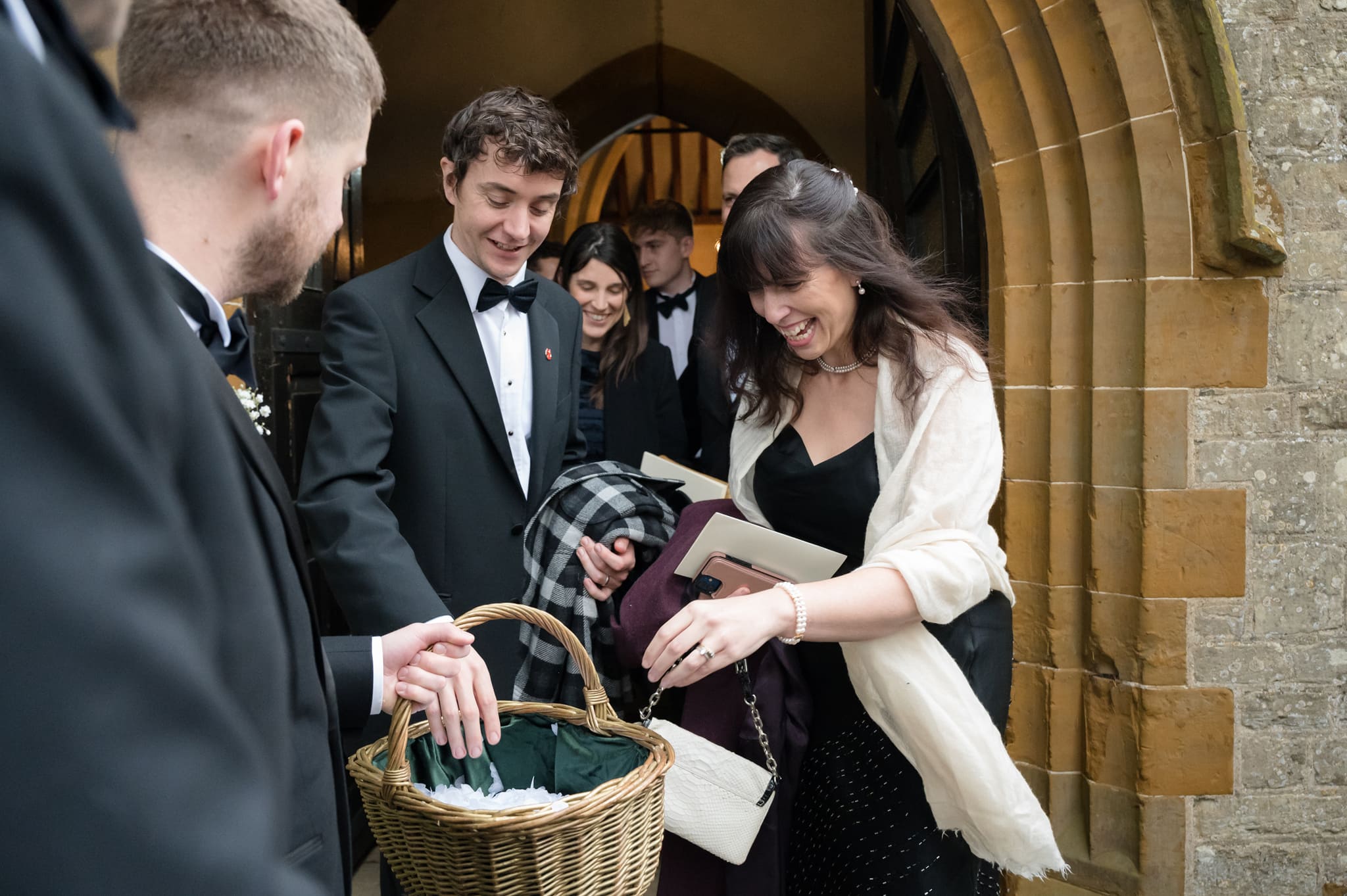 Guests taking confetti from a basket