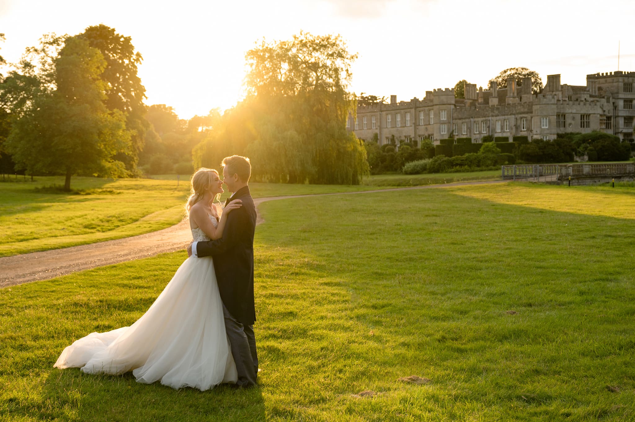 Couple in front of Deene Park at sunset