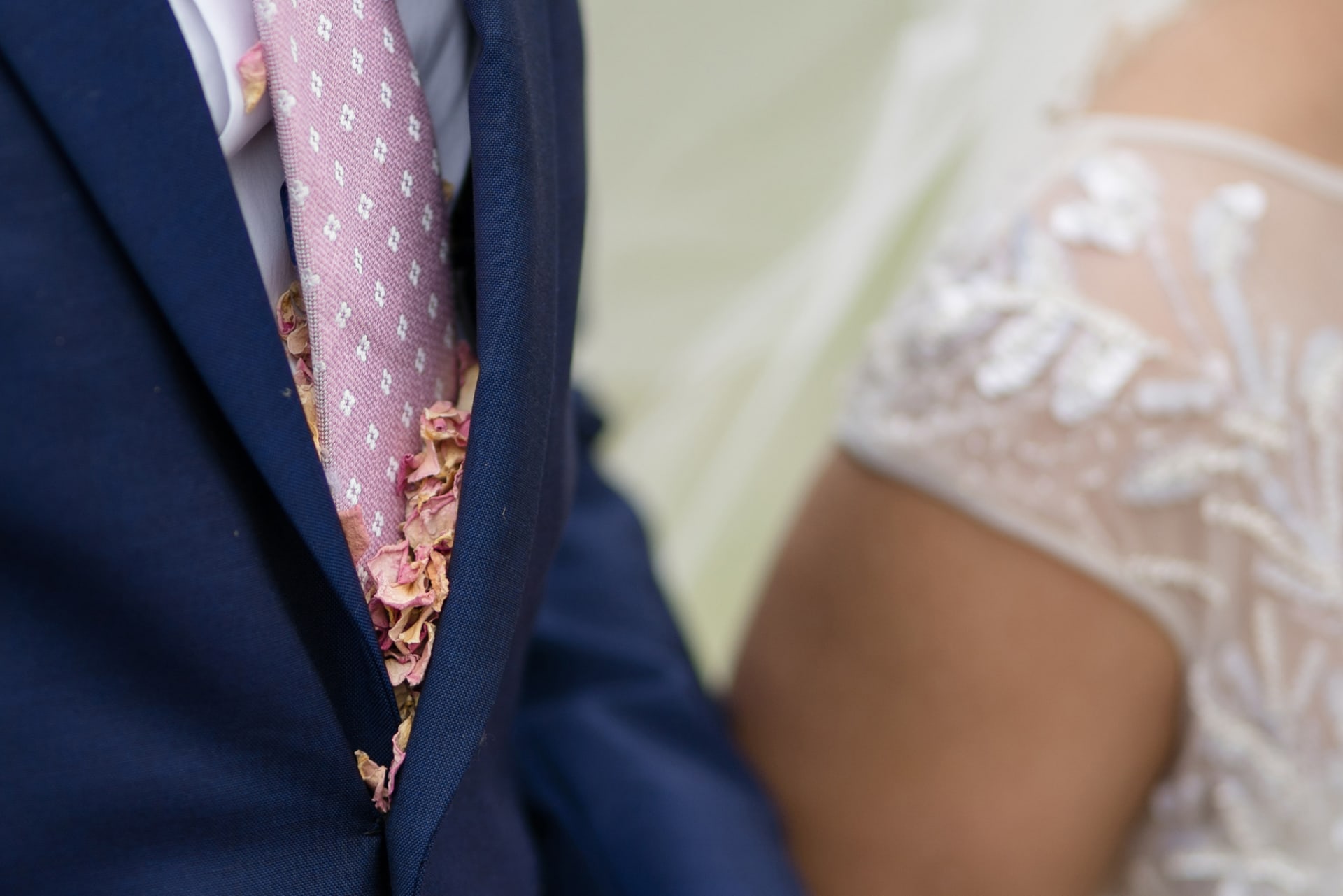 Confetti stuck inside groom's suit