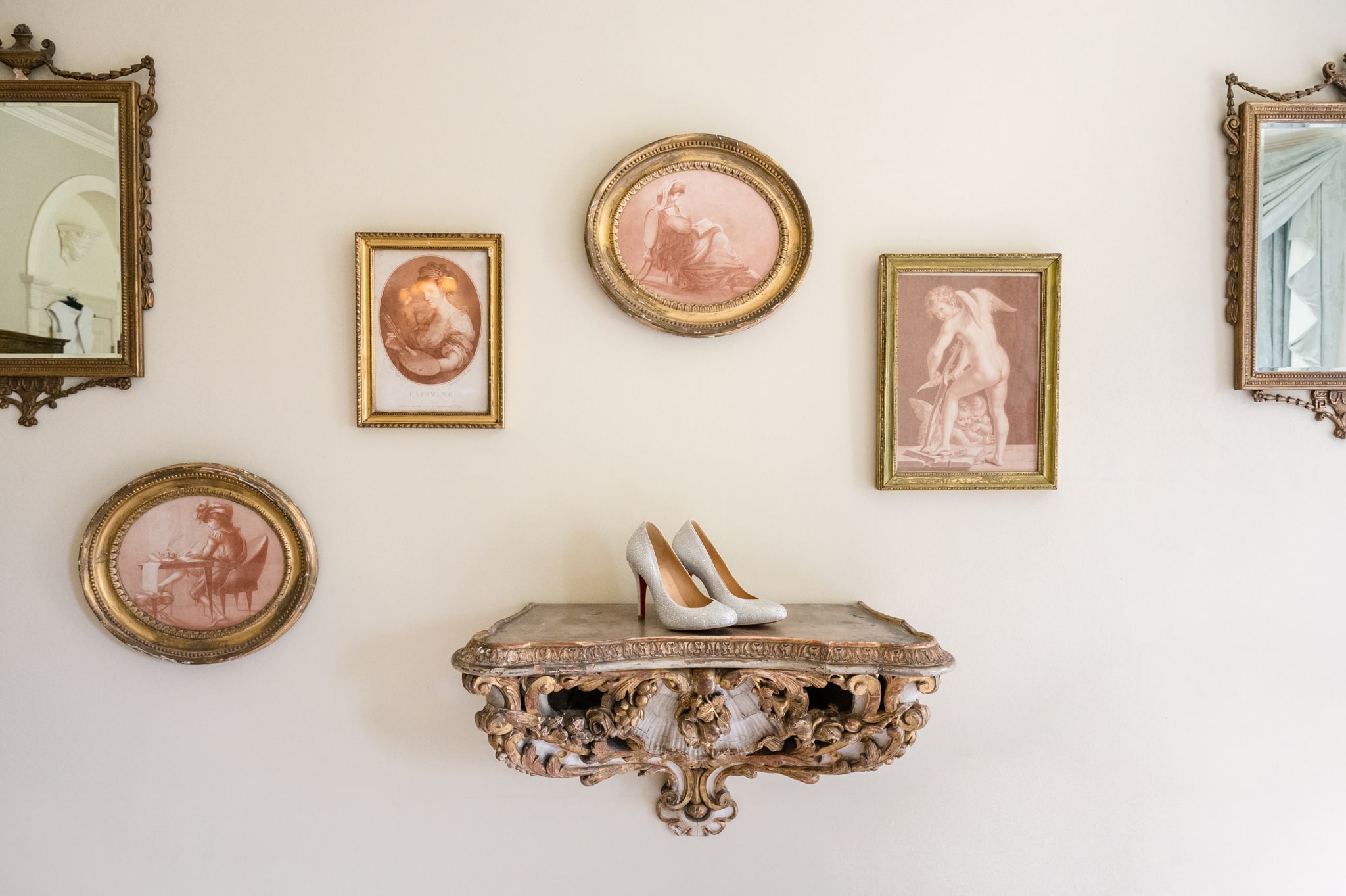 The bride's shoes on an ornate gilt shelf in the bridal suite at Sutton Bonington Hall