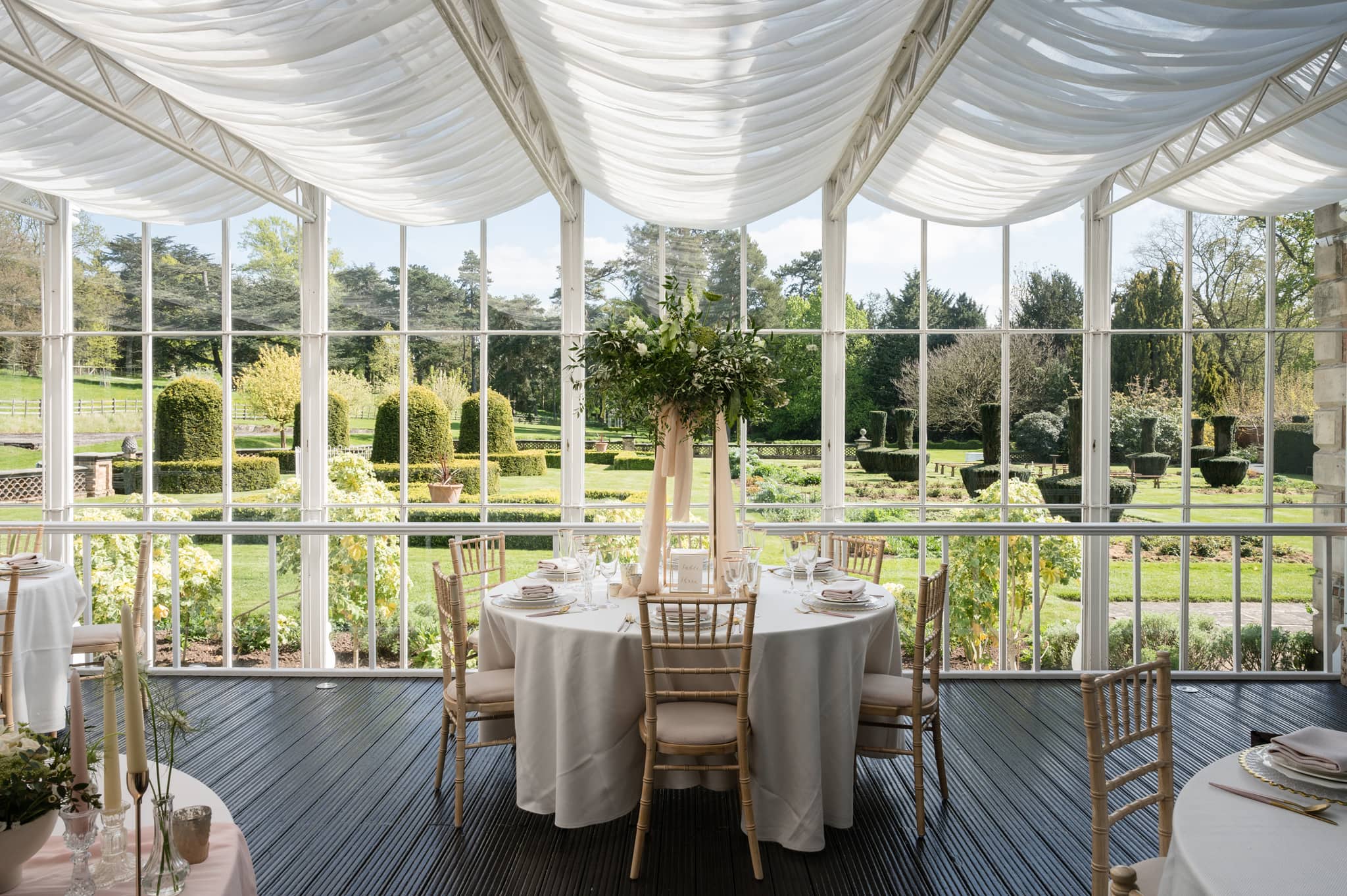 Wedding breakfast set up with views over the gardens at Sutton Bonington Hall