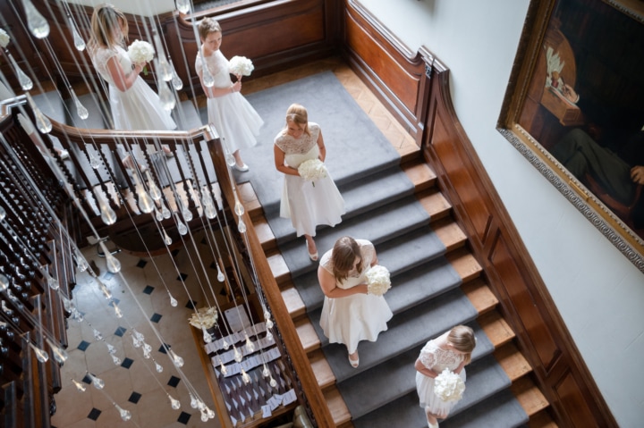 Bridesmaids walking down the staircase