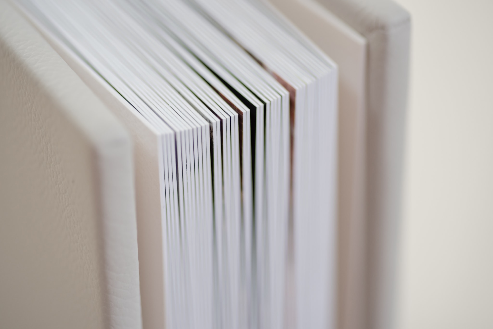 Close up detail showing the thickness of the pages in a fine art wedding album