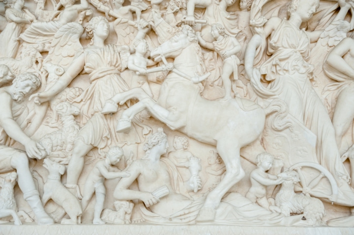 A close-up section of a marble scene full of angels
