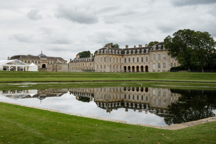 Boughton House reflected in a pool