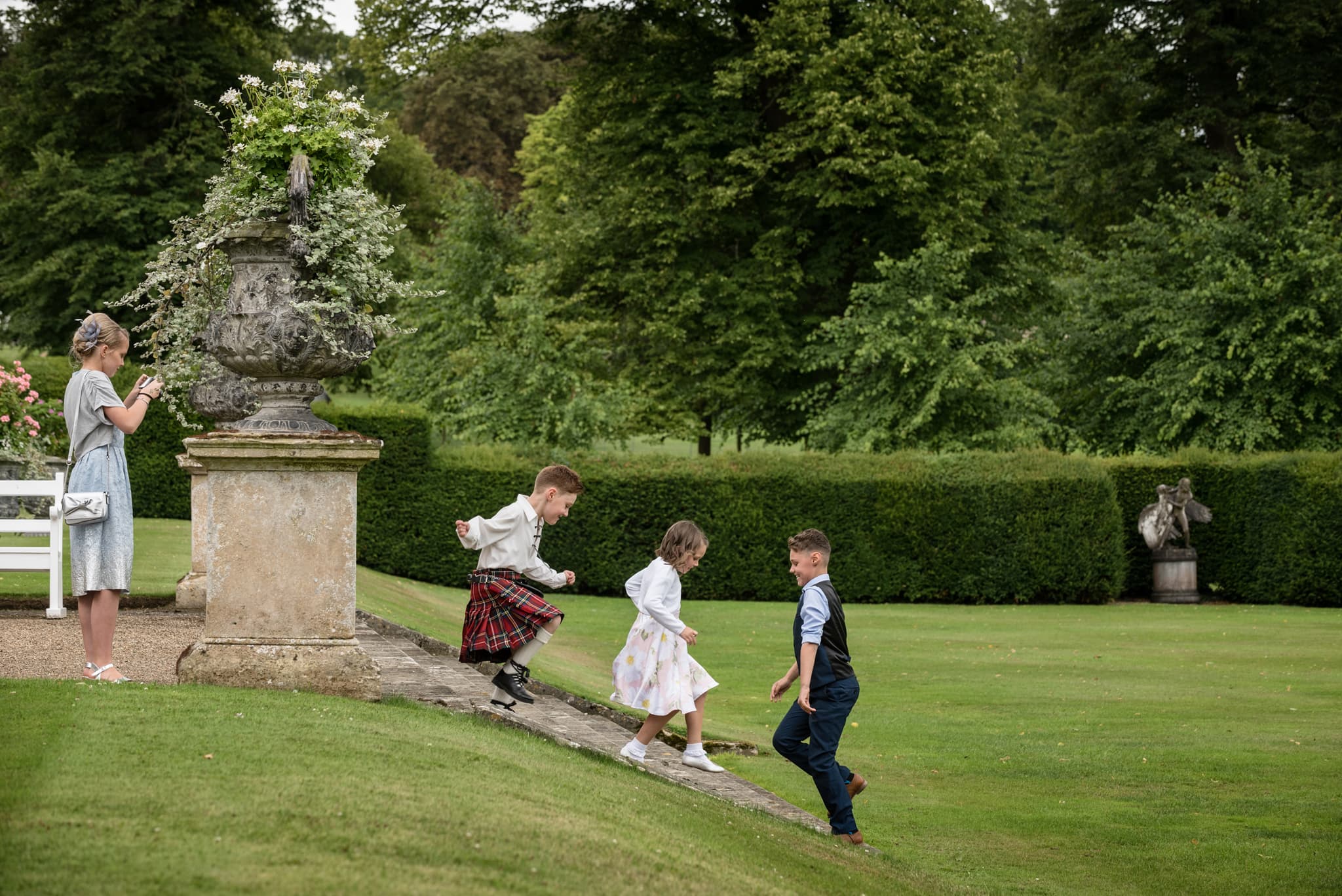 Children playing on steps at Boughton House