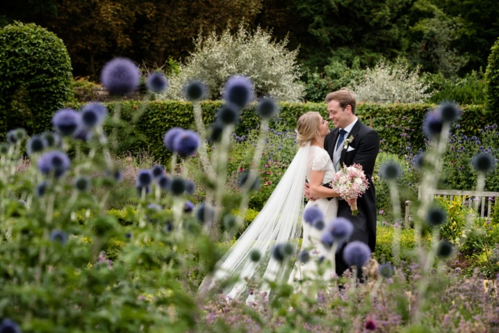Bride and groom in the sensory garden at Boughton House