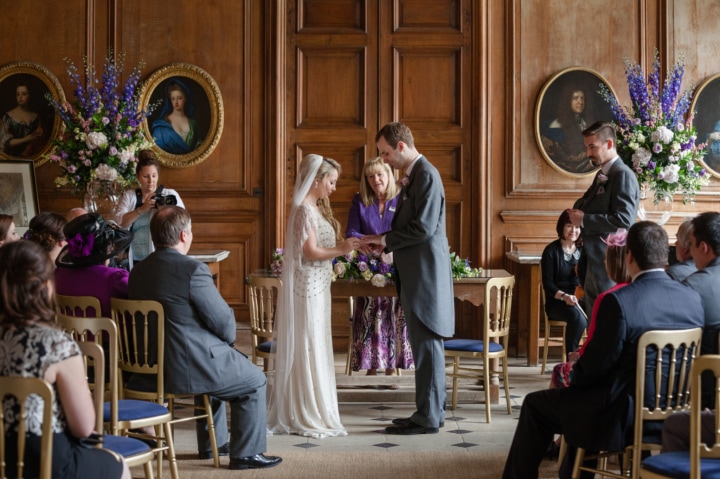 Couple getting married in The Great Hall at Boughton House