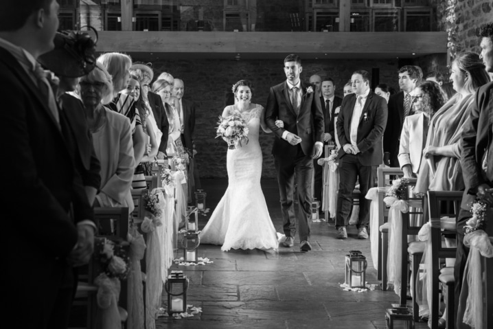 Bride and her dad walking down the aisle at Dodford Manor