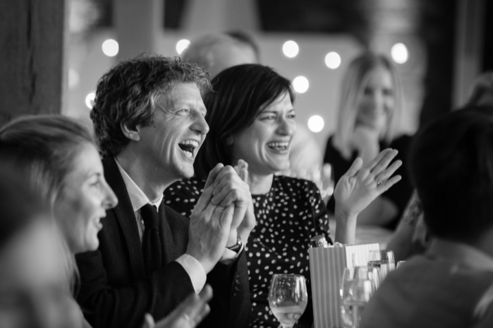 Wedding guests clapping during speeches at Dodford Manor