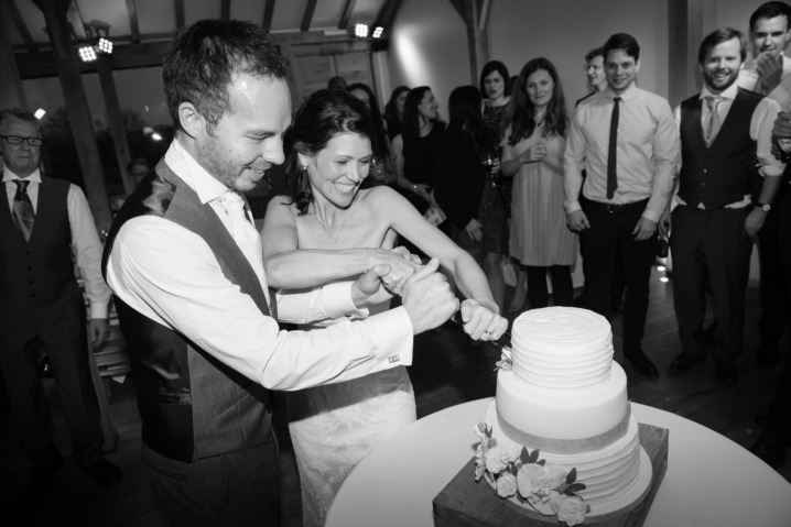 Bride and groom cutting their wedding cake at Dodford Manor