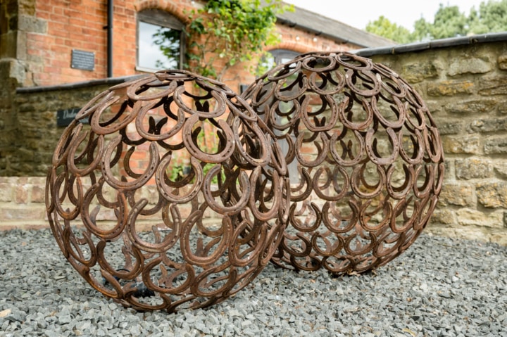 Spheres made of horseshoes at Dodmoor House