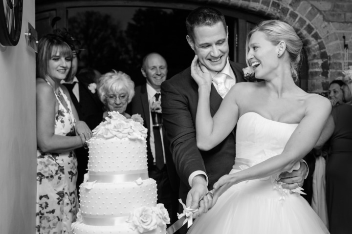 Bride and groom cutting their wedding cake at Dodmoor House