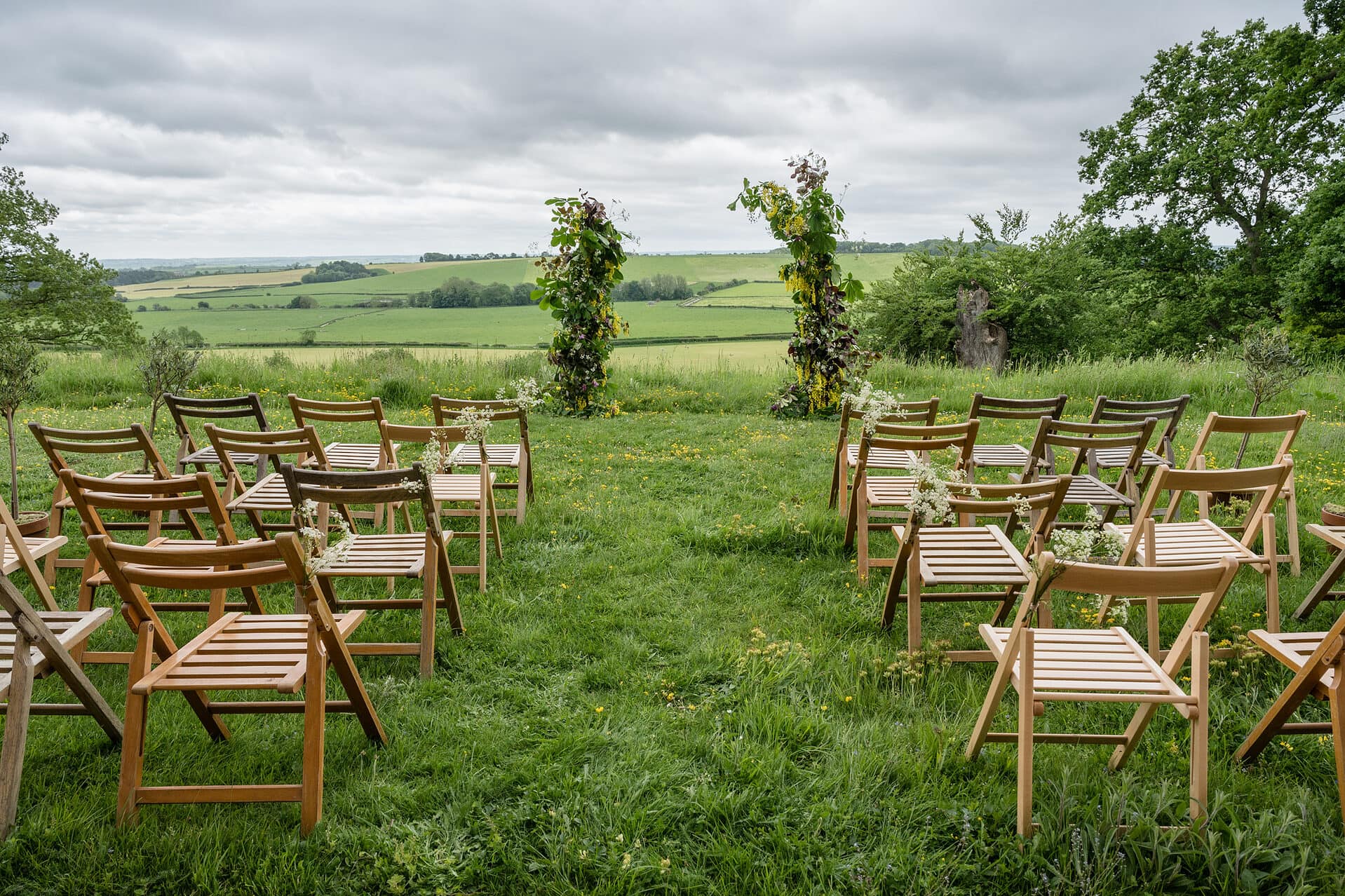 An outdoor wedding ceremony set-up with views of rolling hills at Keythorpe Hall