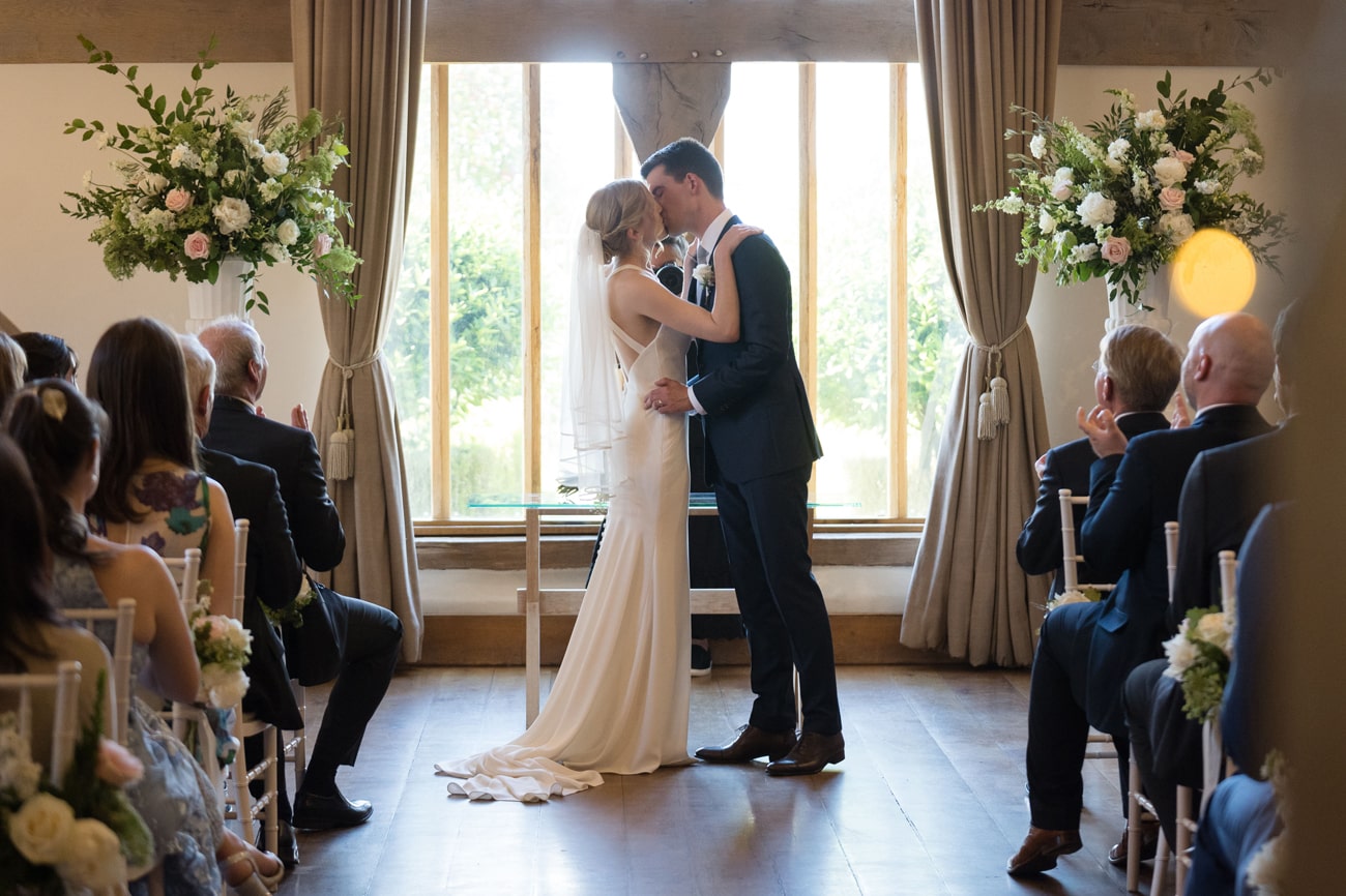 The bride and groom's first kiss at Cain Manor