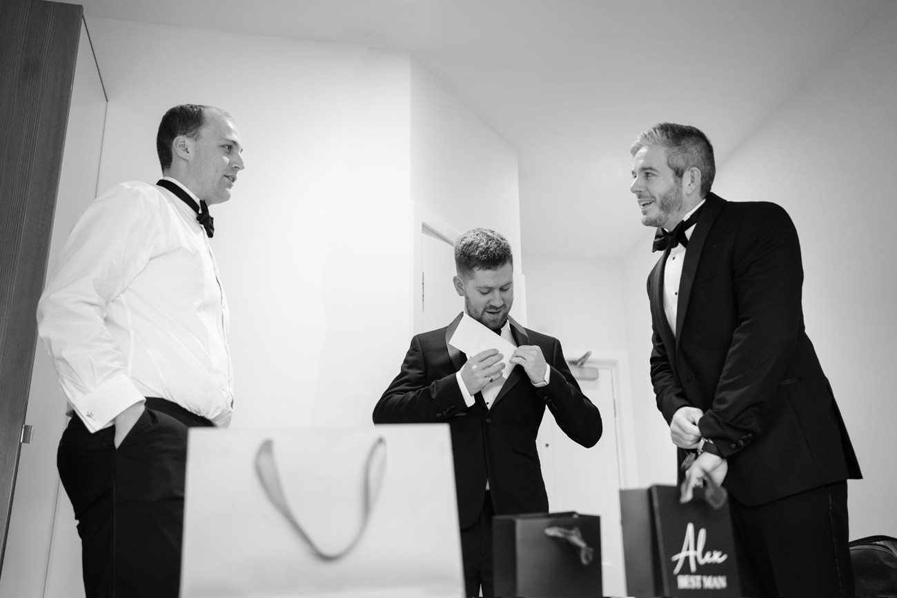 Groomsmen getting ready for the wedding at their hotel