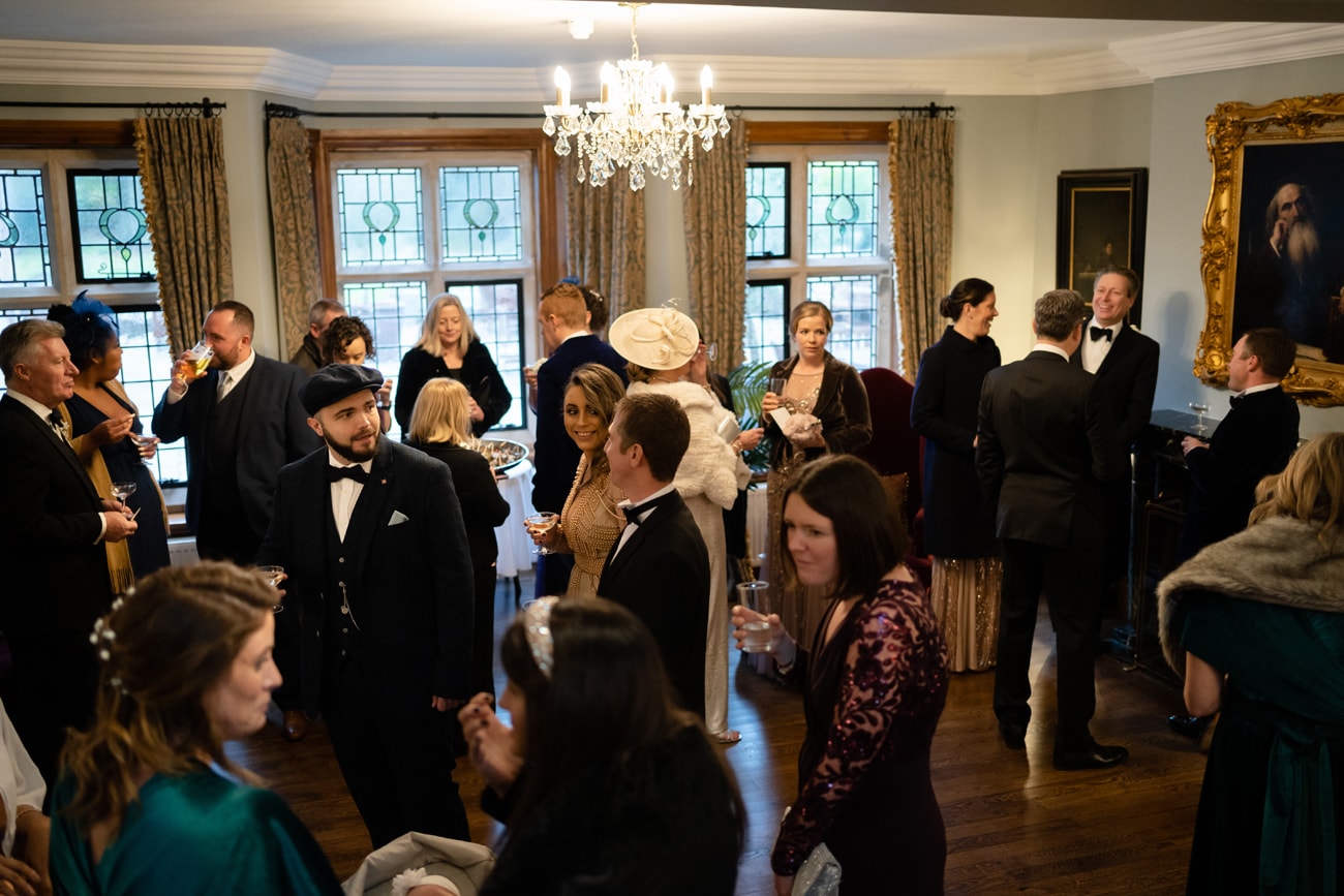 A drinks reception in the entrance hall at Plum Park Manor