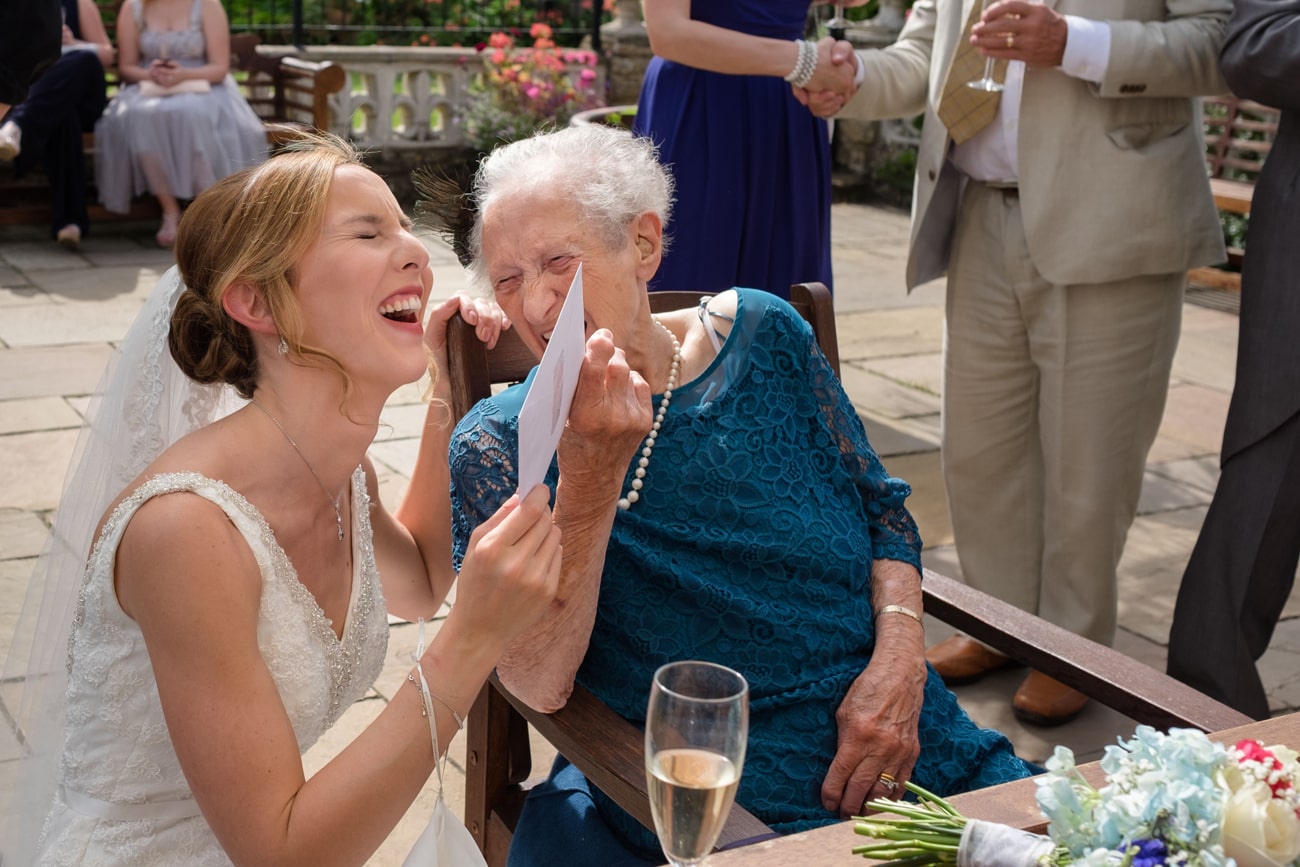 A bride laughing with her gran