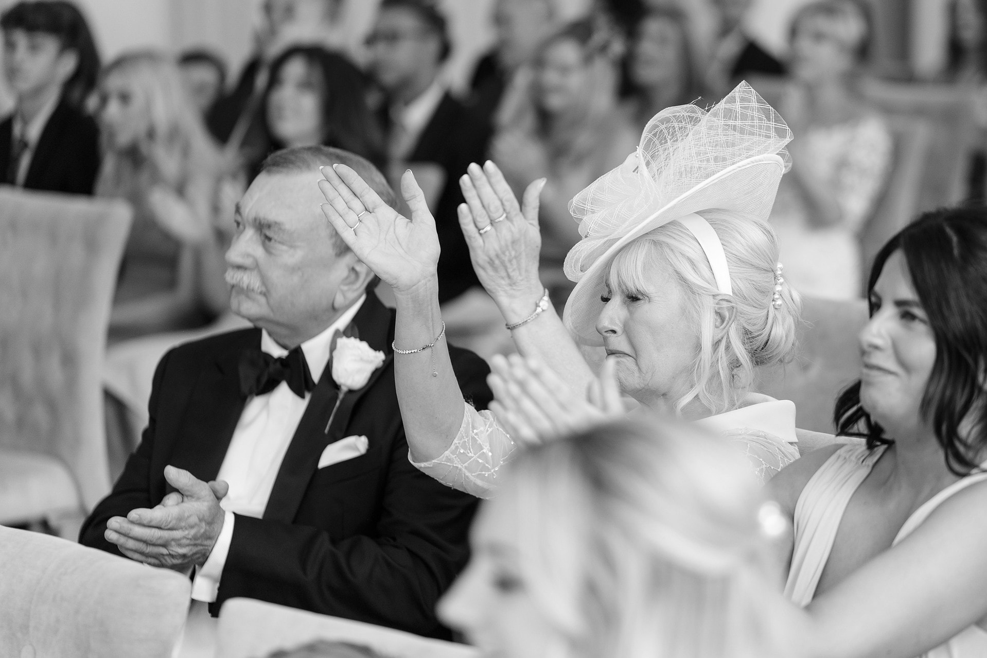 Bride's mum clapping at the ceremony readings