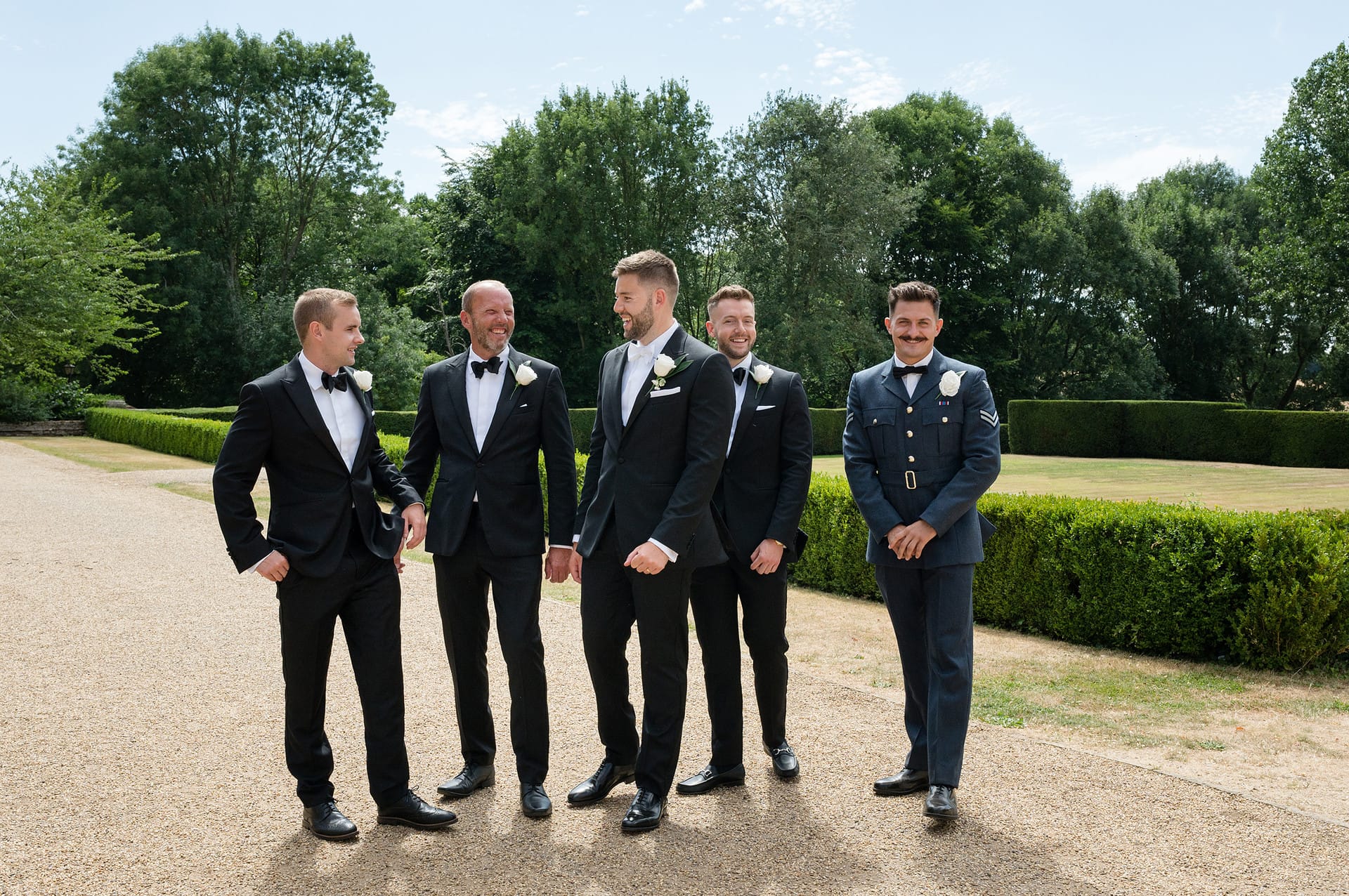 Natural group photo of groom with his best man and ushers