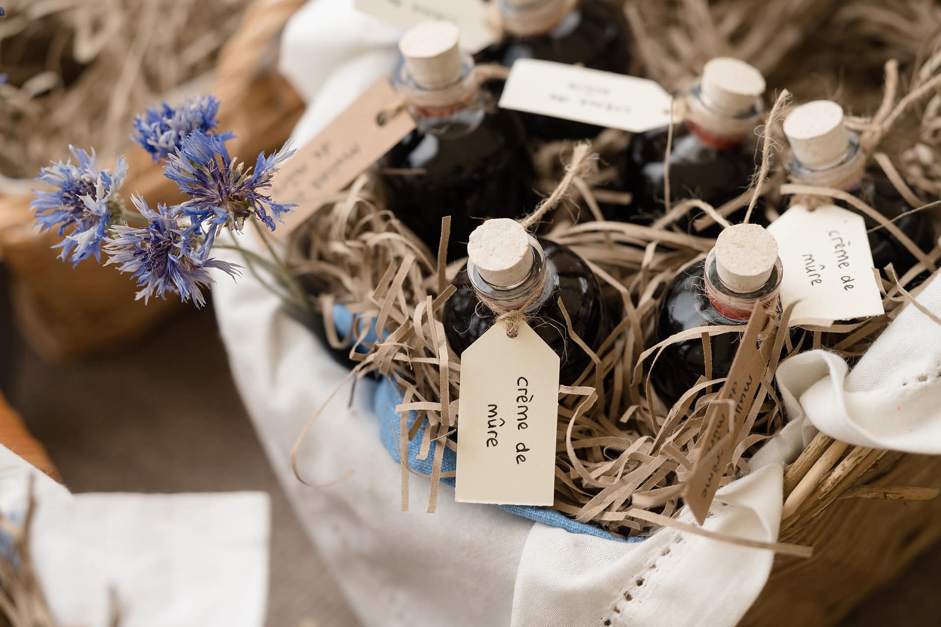 A basket full of miniature bottles of liquer wedding favours