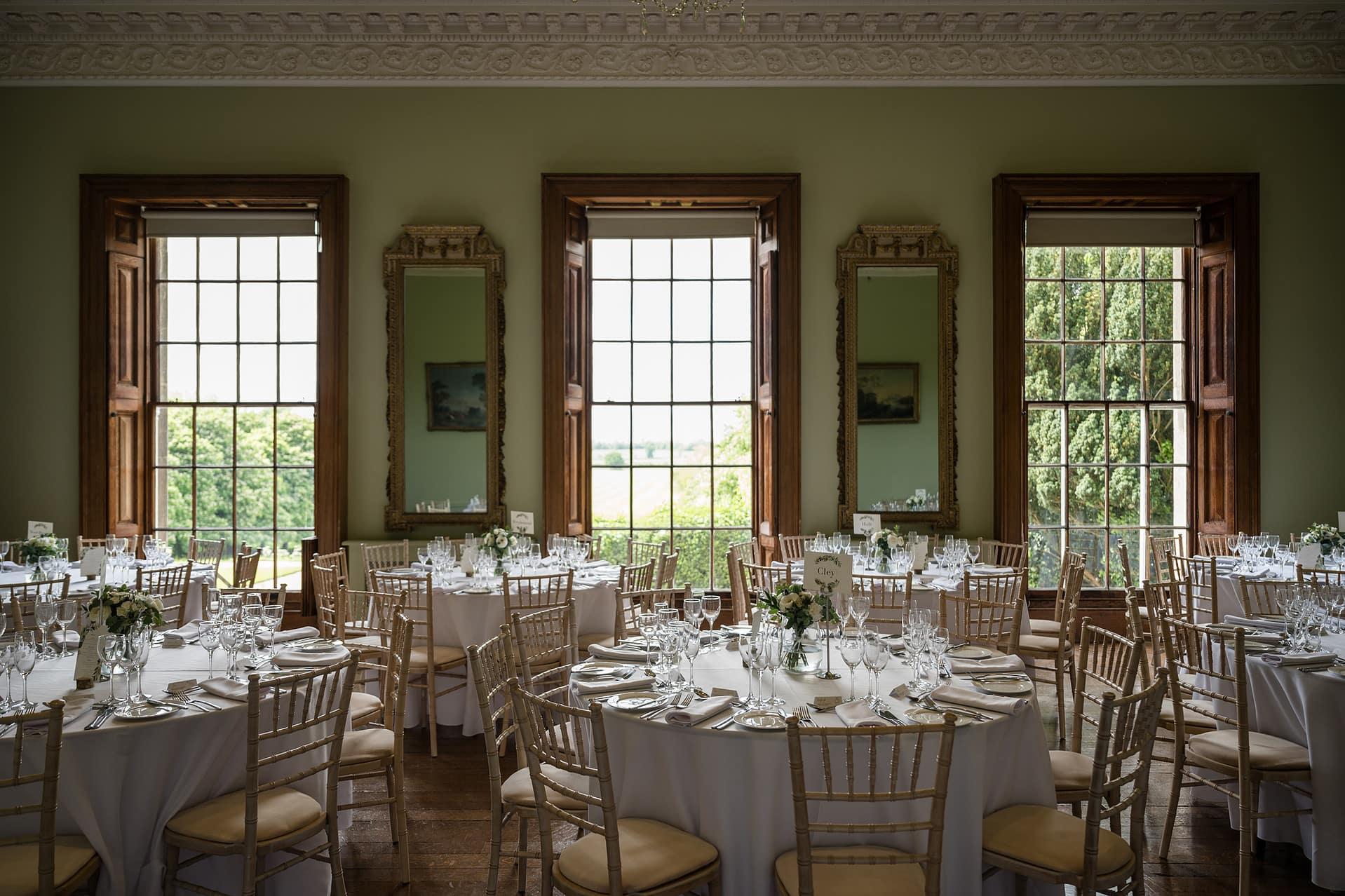 The ballroom at Kelmarsh Hall set for a wedding breakfast