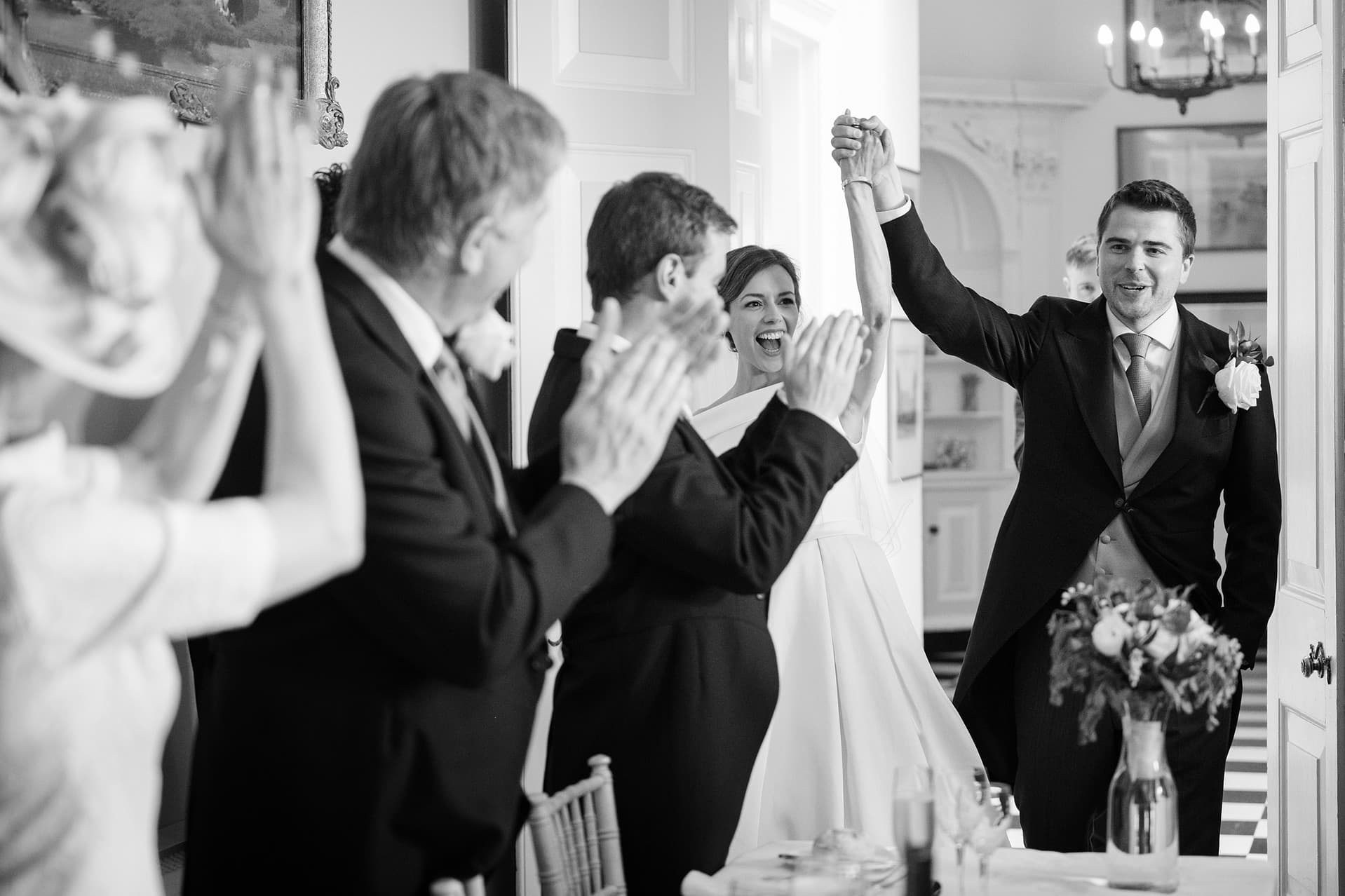 The bride and groom's reaction as they're announced into the room for dinner