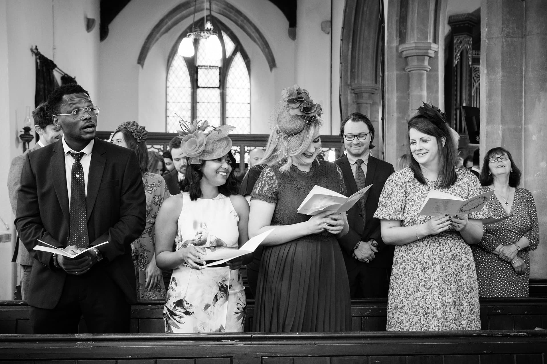 Wedding guests singing hymns at St Catherine's church in Houghton on the Hill