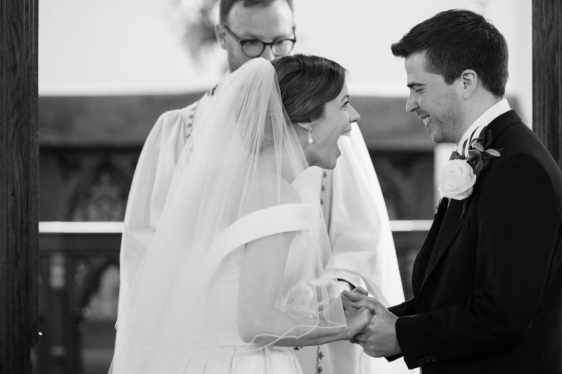 Bride with her mouth agape in delight at being pronounced husband and wife