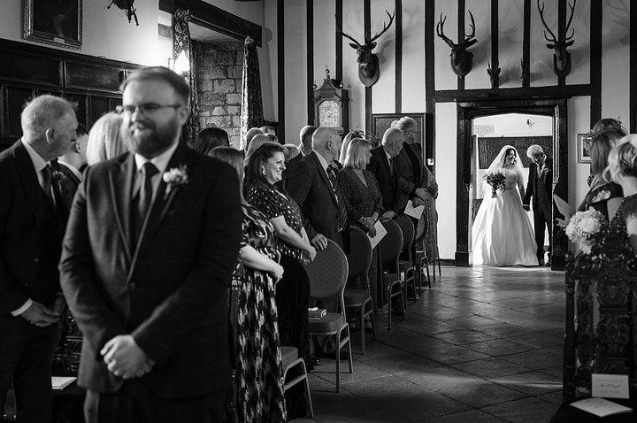 Bride and her Dad about to walk down the aisle at Rockingham Castle