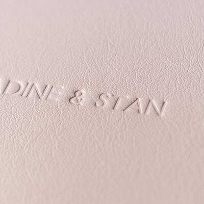 Close up of a debossed title on the front cover of a wedding album