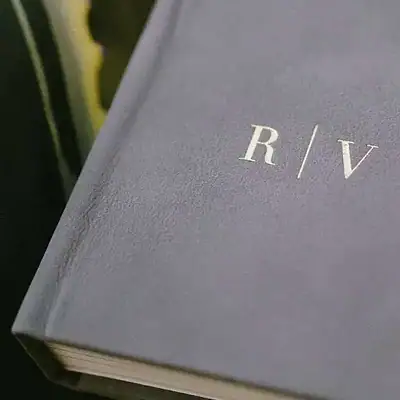 Close up of a bespoke motif on the front cover of a wedding album