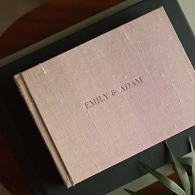 Silk wedding album with a text-based title on the cover