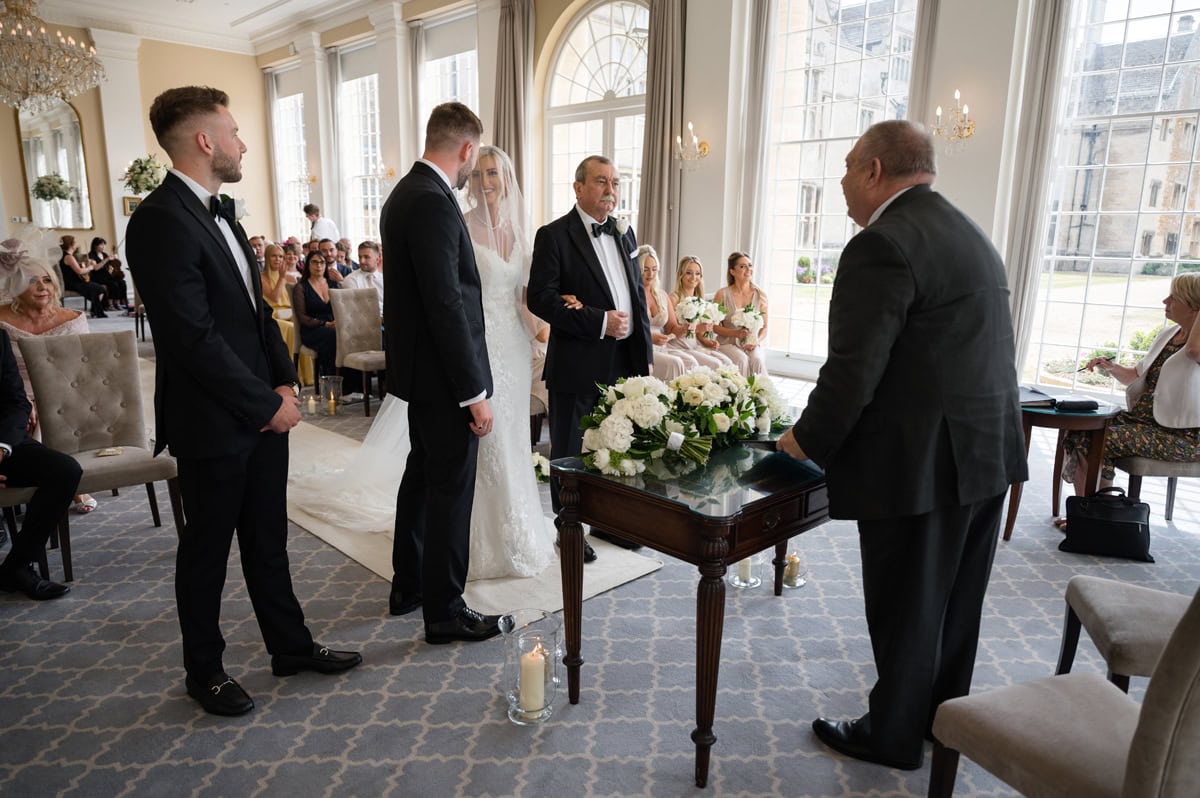 Bride and groom sharing a private chat as their wedding ceremony starts