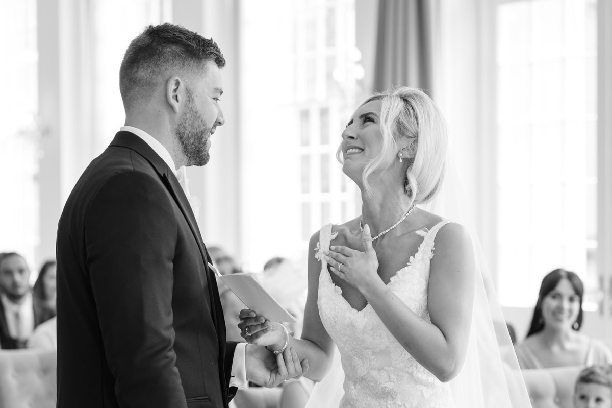 Bride holding back tears as she says personalised wedding vows