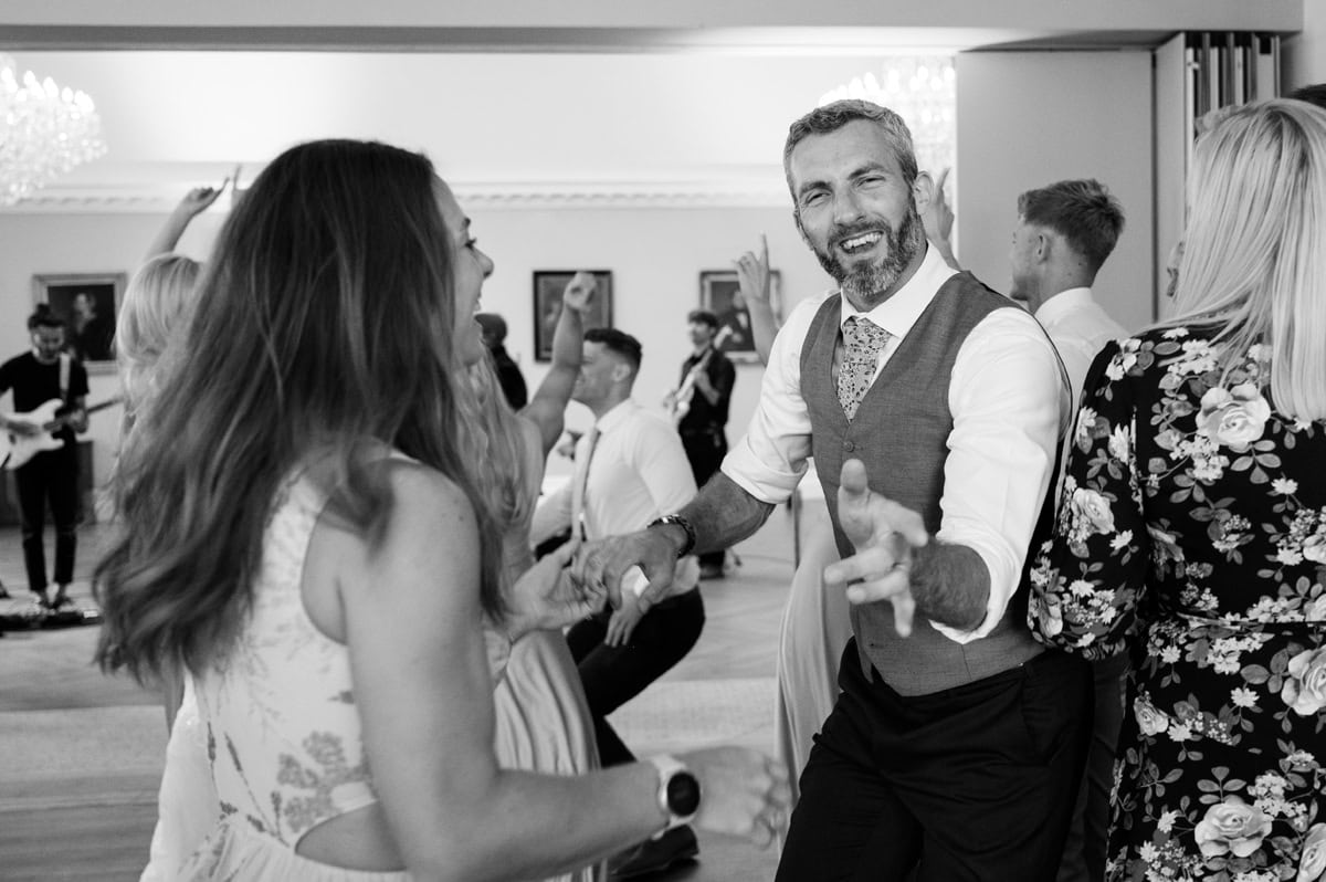 Wedding guests enjoying dancing to a live band